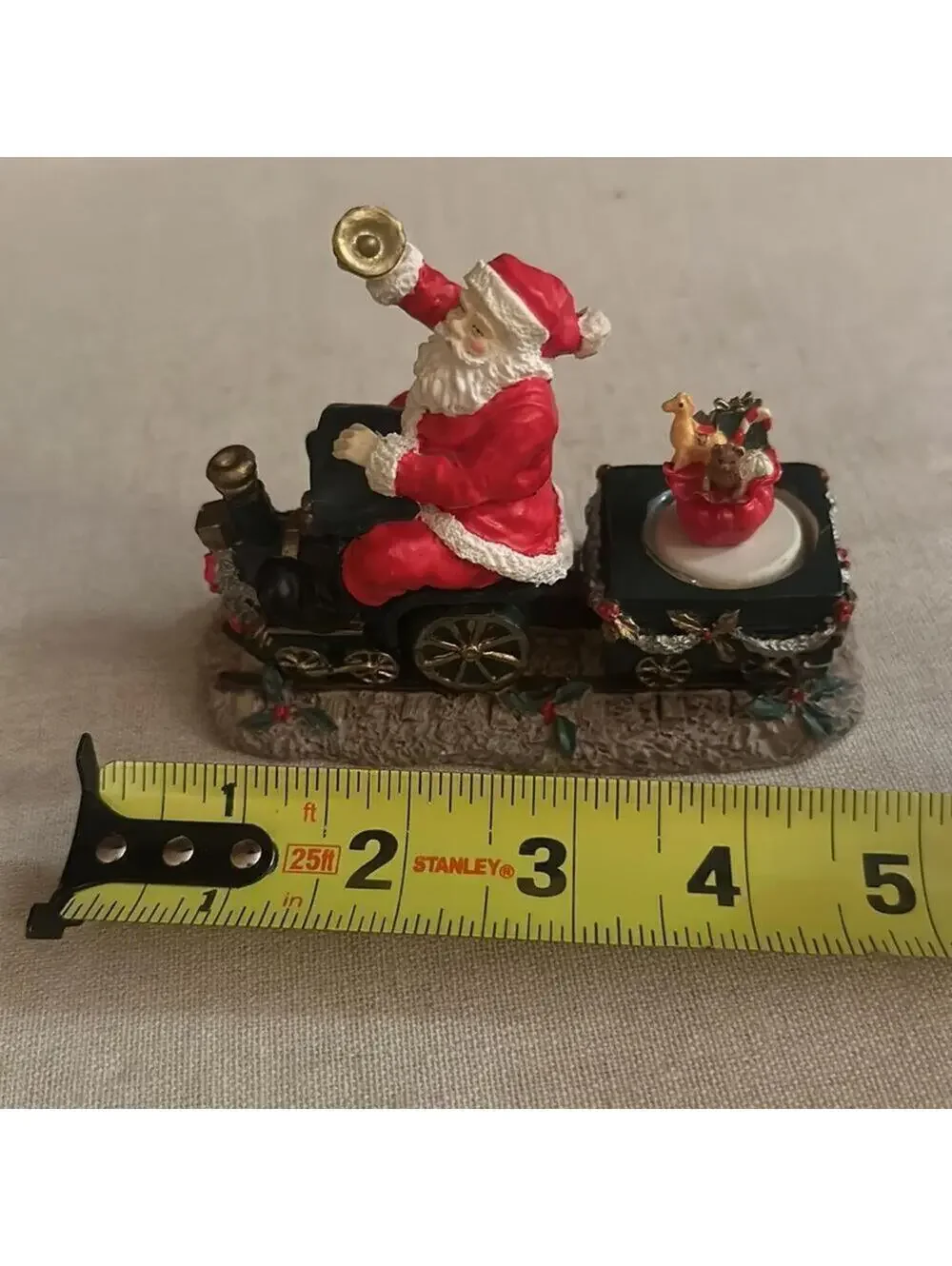 Vintage Santa Claus figurine riding a train w presents